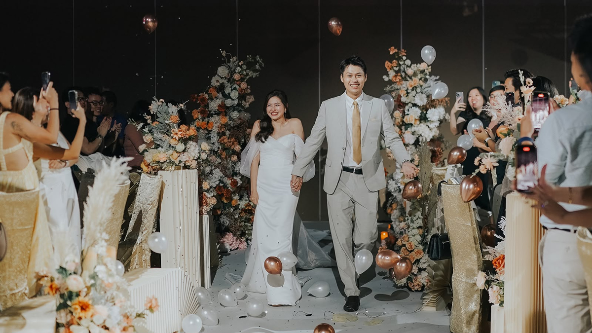 Couple entering their wedding celebration